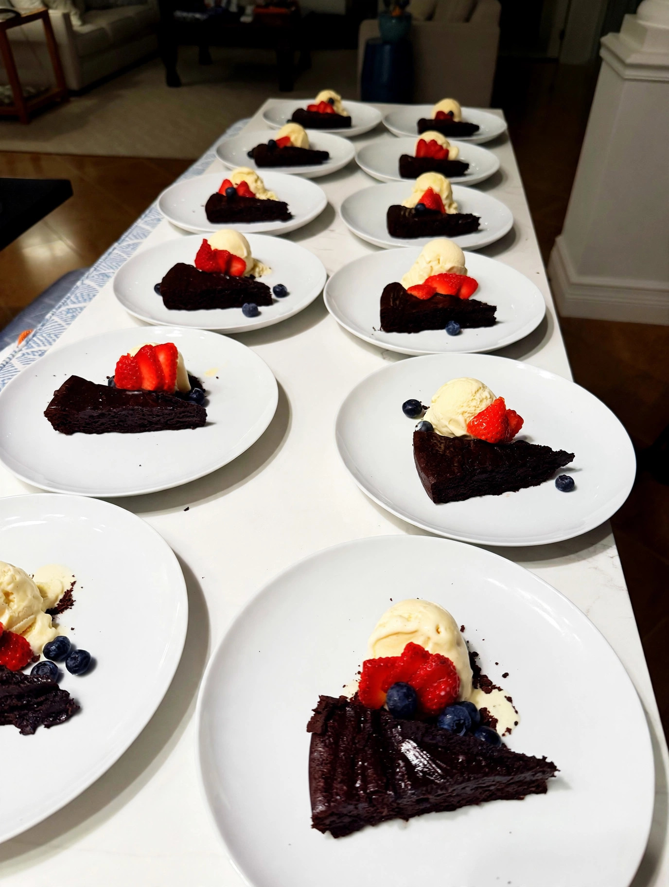 Flourless chocolate torte with vanilla ice cream and berries