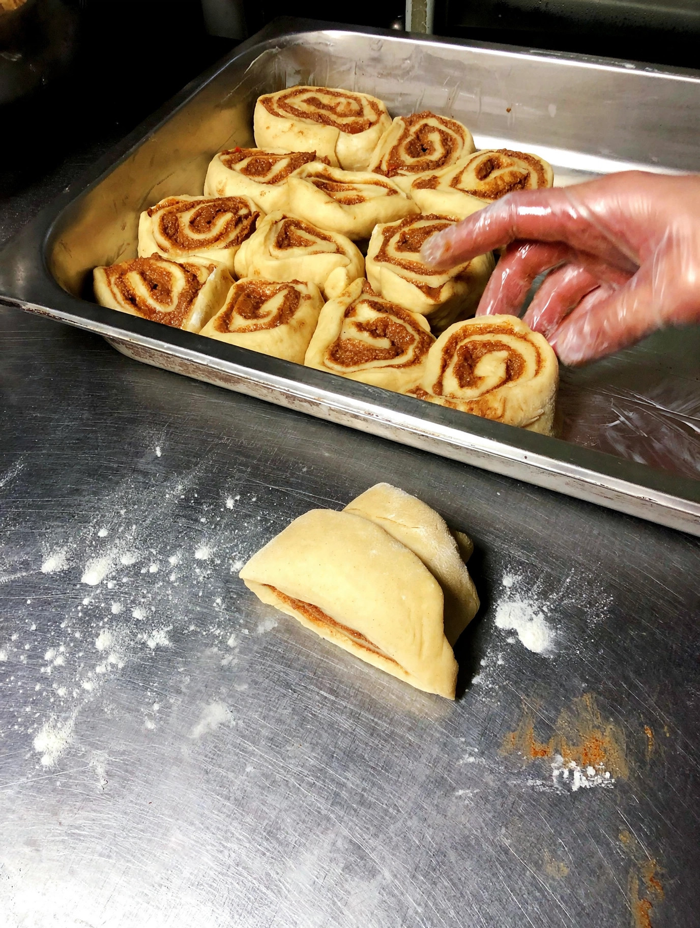 Fresh cinnamon rolls prepped in the kitchen