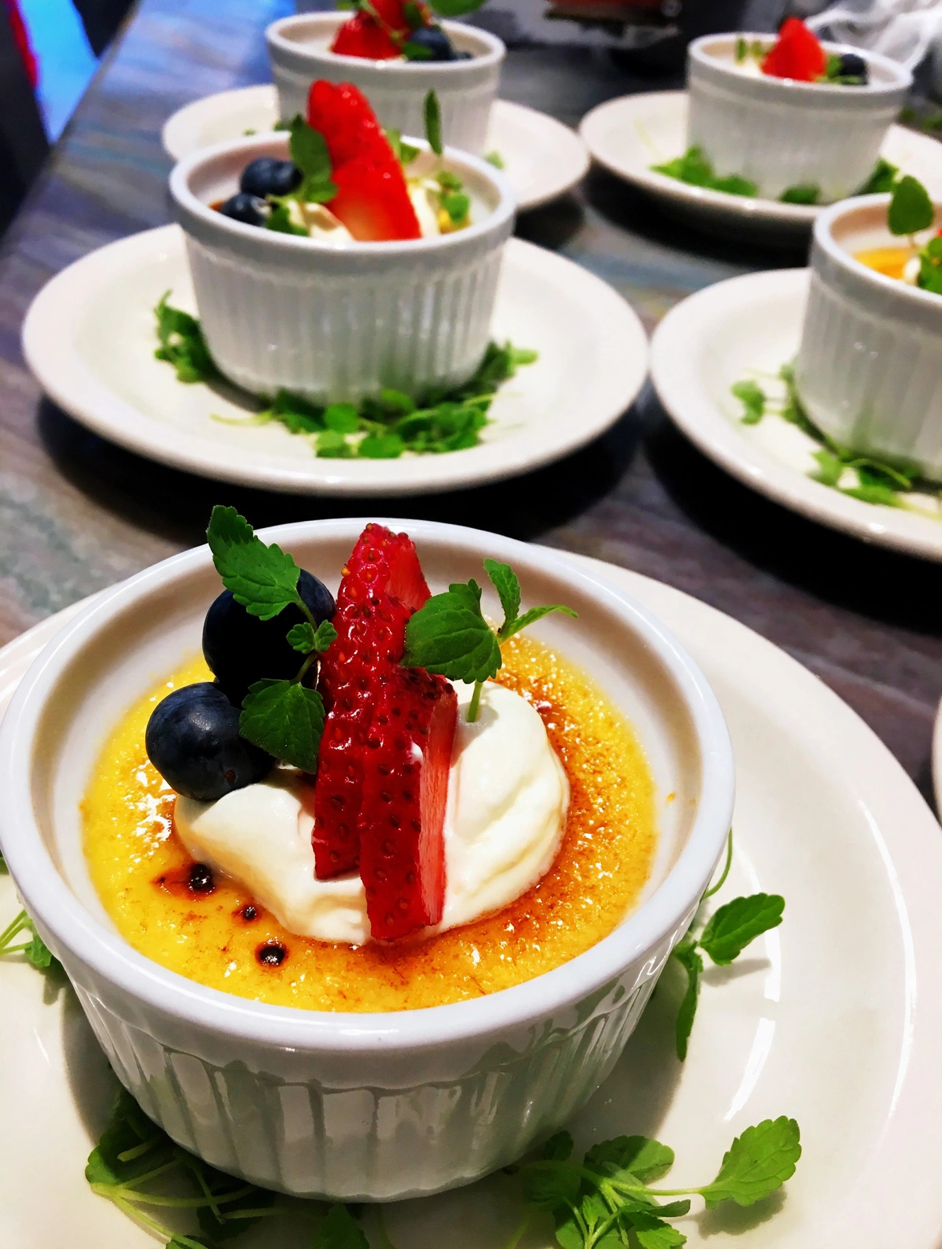 Crème brûlée with fresh berries and cream