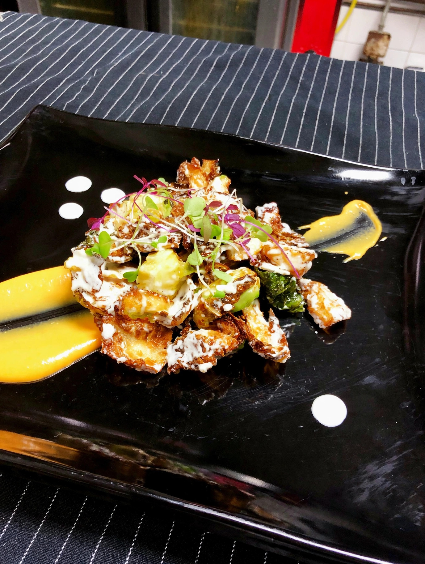 Crispy brussels sprouts with aioli and microgreens