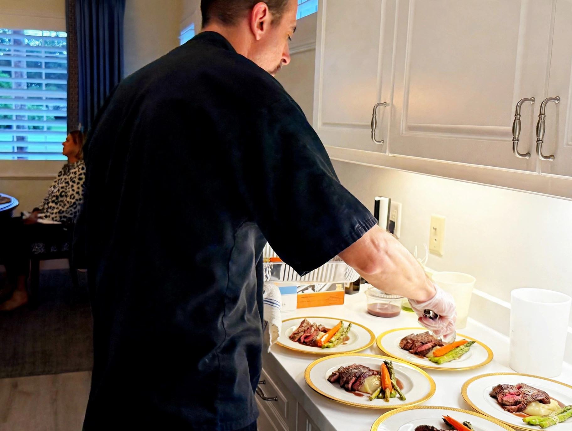 Chef Tony plating in a client's kitchen