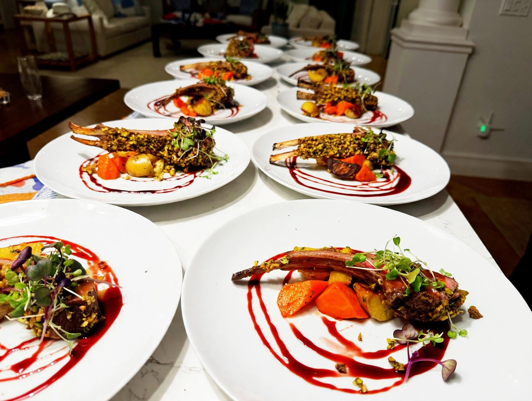 Pistachio-crusted rack of lamb, plated for a dinner party