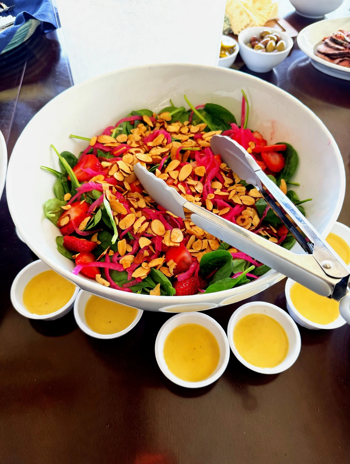 Strawberry spinach salad with almonds and pickled onion