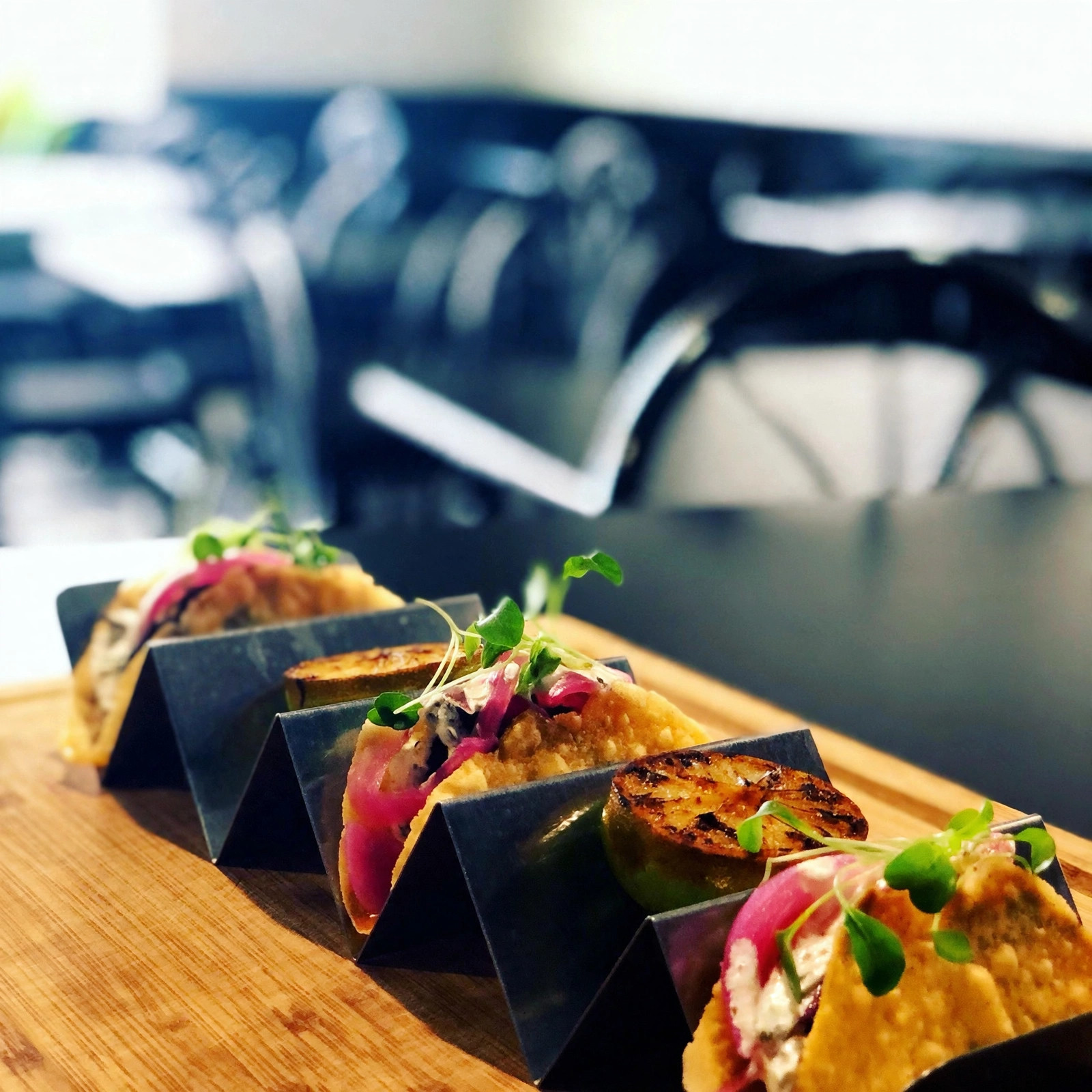 Street tacos with pickled onions and microgreens